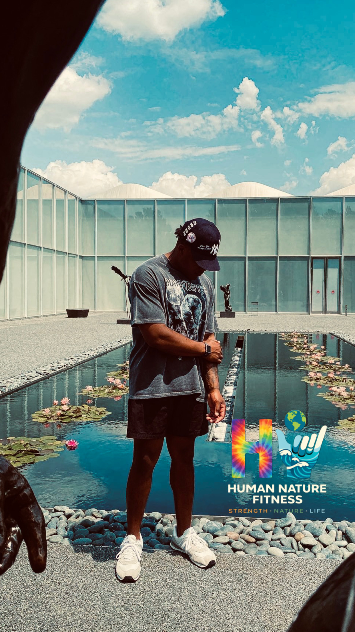 Taking in art and nature beside a reflecting pool